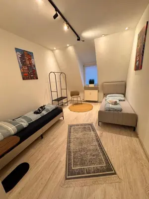 Ein Bett oder Betten in einem Zimmer der Unterkunft A&V Apartments Tiger Nähe Stadion