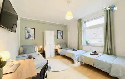Ein Bett oder Betten in einem Zimmer der Unterkunft BEGE APARTMENTS Team Base