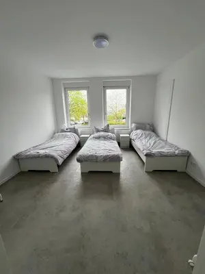 Ein Bett oder Betten in einem Zimmer der Unterkunft Wohnung 8P Zentral Lüdenscheid