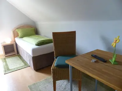 Ein Bett oder Betten in einem Zimmer der Unterkunft Haus der Gastlichkeit