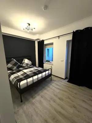 Ein Bett oder Betten in einem Zimmer der Unterkunft E&S Apartments