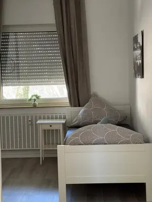 Ein Bett oder Betten in einem Zimmer der Unterkunft Stilvolles Apartment Royal Zentral Ruhig & Parkplatz inkl