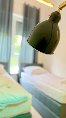 Ein Bett oder Betten in einem Zimmer der Unterkunft Perfect for fans and travelers