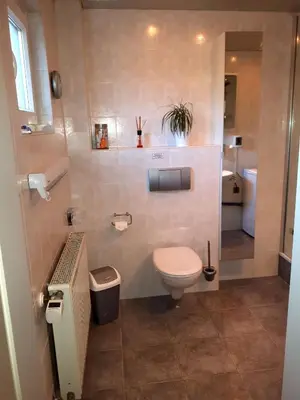 Ein Badezimmer in der Unterkunft FeWo-Orsoyerberg
