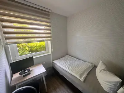 Ein Bett oder Betten in einem Zimmer der Unterkunft Bach's Restaurant Bar Hotel