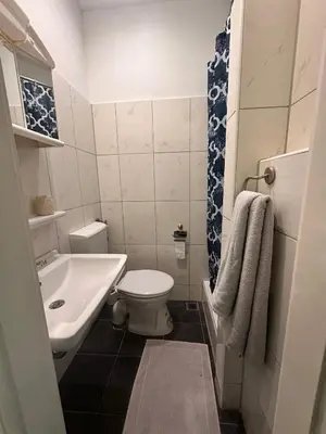 Ein Badezimmer in der Unterkunft Bach's Restaurant Bar Hotel