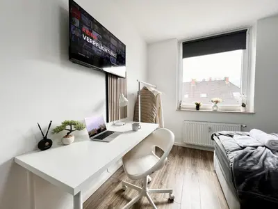 TV/Unterhaltungsangebot in der Unterkunft Zentrale City Ferienwohnung Essen 3 Zimmer Balkon Messe