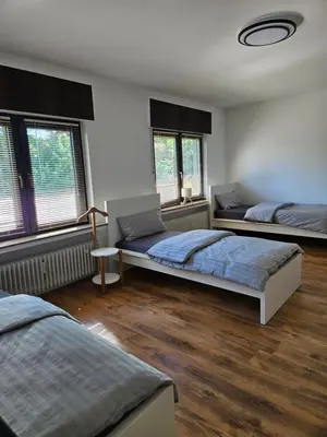 Ein Bett oder Betten in einem Zimmer der Unterkunft MaxMir - Ortlohn Iserlohn