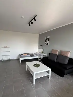 Ein Sitzbereich in der Unterkunft Moderne 3,5 Zimmer 85m2 & Balkon Wohnung