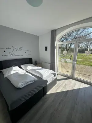 Ein Bett oder Betten in einem Zimmer der Unterkunft Ferienwohnung Sühling
