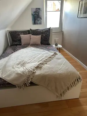 Ein Bett oder Betten in einem Zimmer der Unterkunft Oase für Reisende & Geschäftsleute