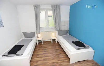 Ein Bett oder Betten in einem Zimmer der Unterkunft BEGE APARTMENTS StayForWork