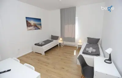 Ein Bett oder Betten in einem Zimmer der Unterkunft BEGE APARTMENTS WorkBase