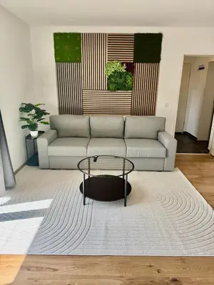 Ein Sitzbereich in der Unterkunft FeWo-Palmtrees 4 - Große moderne 2 Zimmerwohnung mit Süd-West Balkon in Gladbeck-Mitte Nähe Movie Park und Arena AufSchalke