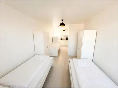 Ein Bett oder Betten in einem Zimmer der Unterkunft L21-Apartment Dortmund, 2 Zimmer, 4 Betten, Standardisierte Ausstattung, ideal für Reisende, Pendler, Familien