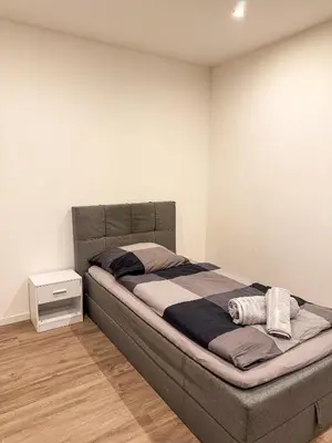 Ein Bett oder Betten in einem Zimmer der Unterkunft Ruhr Business Apartments Essen Apartment mit 8 Einzelbetten Privat Parkplatz