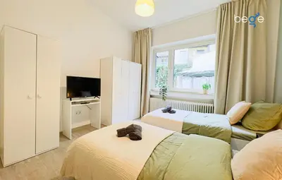 Ein Bett oder Betten in einem Zimmer der Unterkunft BEGE APARTMENTS HomeBase