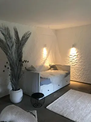 Ein Bett oder Betten in einem Zimmer der Unterkunft Das Gartenhäuschen im Landhaus im Park