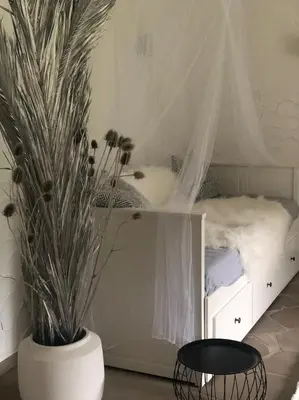 Ein Bett oder Betten in einem Zimmer der Unterkunft Das Gartenhäuschen im Landhaus im Park