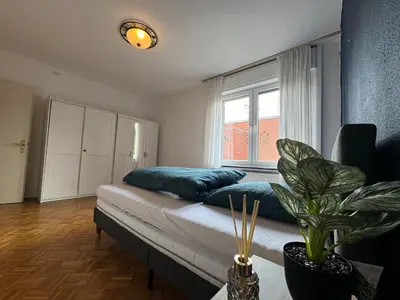 Ein Bett oder Betten in einem Zimmer der Unterkunft Nathanael Ferienwohnung mit Küche, WLAN & 4 Schlafzimmern