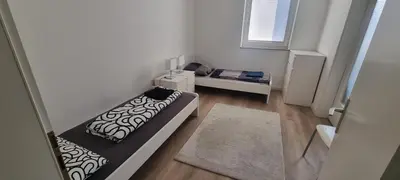 Ein Bett oder Betten in einem Zimmer der Unterkunft Zentrumsnahe 4 Zimmer Etagenwohnung für bis zu 7 Personen