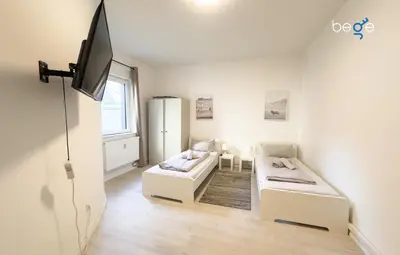 Ein Bett oder Betten in einem Zimmer der Unterkunft BEGE APARTMENTS TeamLodge