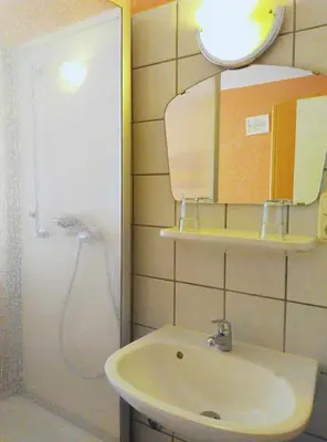 Ein Badezimmer in der Unterkunft Hotel Yans