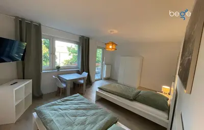 Ein Bett oder Betten in einem Zimmer der Unterkunft BEGE APARTMENTS WorkVibe Stay