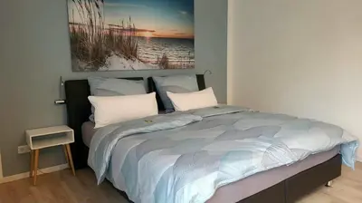 Ein Bett oder Betten in einem Zimmer der Unterkunft Neues Ruhrtal Apartment 3 mit Klimaanlage, Balkon
