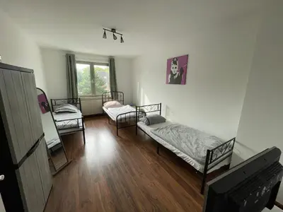 Ein Bett oder Betten in einem Zimmer der Unterkunft MAD Ferienwohnungen 3