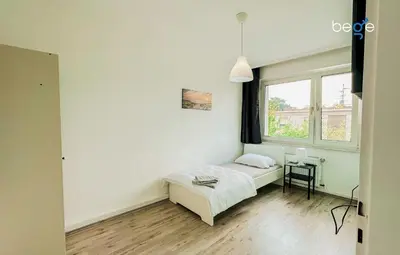 Ein Bett oder Betten in einem Zimmer der Unterkunft BEGE APARTMENTS StayWell