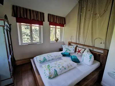 Ein Bett oder Betten in einem Zimmer der Unterkunft HR Cottage am Honigbach