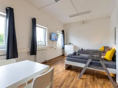 Ein Sitzbereich in der Unterkunft XXL Worker Place Herne