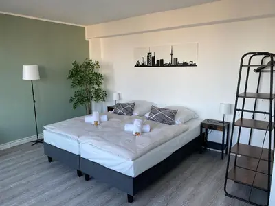Ein Bett oder Betten in einem Zimmer der Unterkunft City Appartment