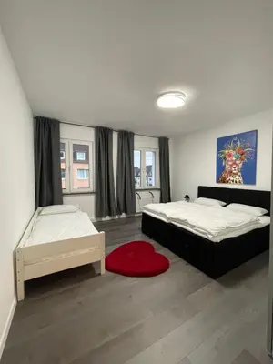 Ein Bett oder Betten in einem Zimmer der Unterkunft Sweet Home Premium Appartement 3