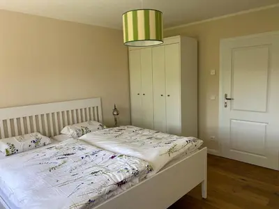 Ein Bett oder Betten in einem Zimmer der Unterkunft Baumberger Blick