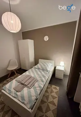 Ein Bett oder Betten in einem Zimmer der Unterkunft BEGE APARTMENTS StaySpace