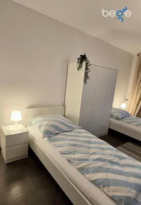 Ein Bett oder Betten in einem Zimmer der Unterkunft BEGE APARTMENTS StaySpace