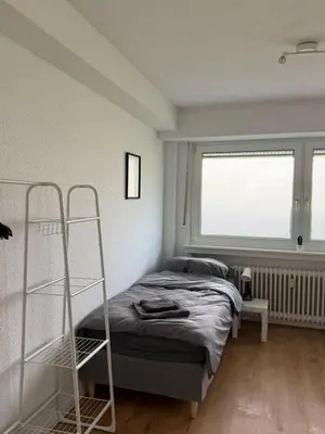 Ein Bett oder Betten in einem Zimmer der Unterkunft Moderne Ferienwohnung Ratingen