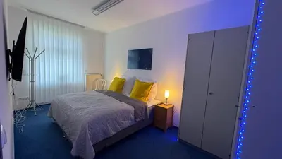 Ein Bett oder Betten in einem Zimmer der Unterkunft Charming Apartment in historischer Polizeiwache