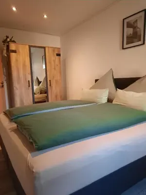Ein Bett oder Betten in einem Zimmer der Unterkunft Ferienwohnung Höhendorf 5-Sterne-DTV