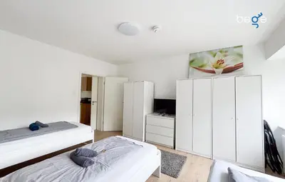 Ein Bett oder Betten in einem Zimmer der Unterkunft BEGE APARTMENTS UrbanWork