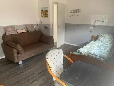 Ein Sitzbereich in der Unterkunft Kaminstube Hof Friebe