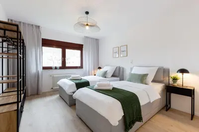 Ein Bett oder Betten in einem Zimmer der Unterkunft Moderne Ferienwohnungen in ruhiger Lage