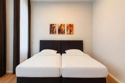 Ein Bett oder Betten in einem Zimmer der Unterkunft la Plaza24