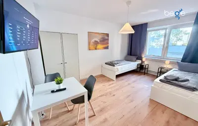 Ein Bett oder Betten in einem Zimmer der Unterkunft BEGE APARTMENTS CityApartment