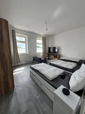 Ein Bett oder Betten in einem Zimmer der Unterkunft Seibel's SUITES - Big in Essen - Family & Group