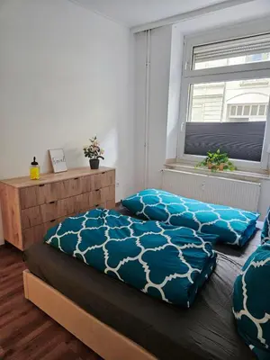 Ein Bett oder Betten in einem Zimmer der Unterkunft Schöne gemütliche Wohnung im Wasserviertel Stadtnah, A40,nähe der Uni oder Zoo