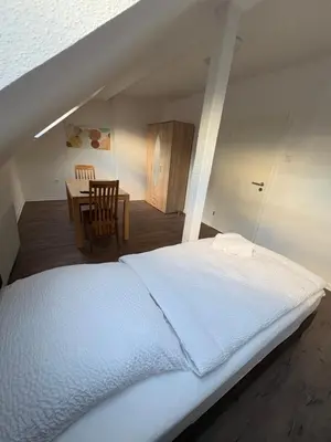 Ein Bett oder Betten in einem Zimmer der Unterkunft Ferienwohnung Victoria