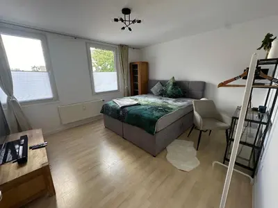 Ein Bett oder Betten in einem Zimmer der Unterkunft Seibel's SUITES - Ruhrpott Oase Altenessen-Mitte